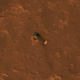 The parachute. The bright spot is a reflection caused by its backshell.